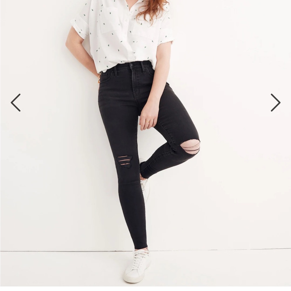 Madewell black jeans with distressed look in knees 
with a skinny leg.Tall 25"